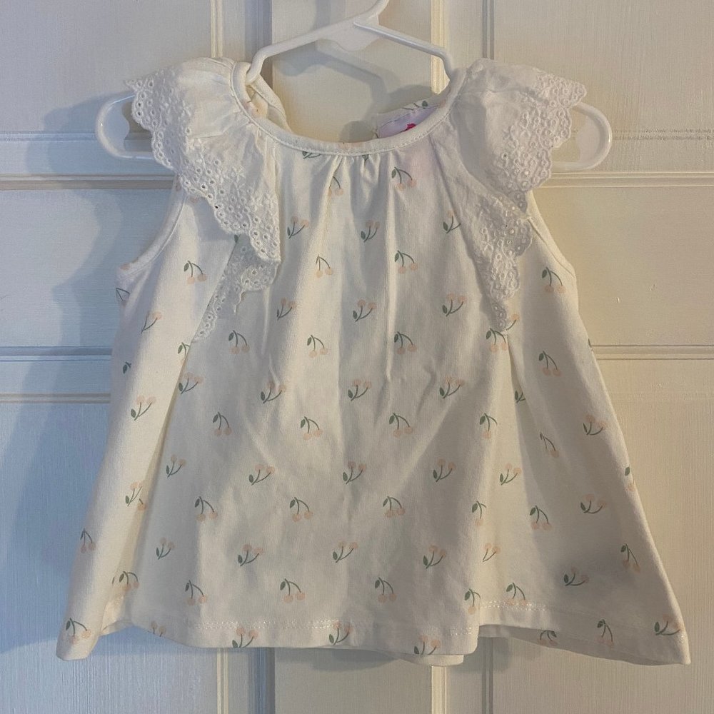 Cap Sleeved Shirt with Eyelet Detail